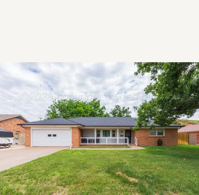 6102 Calumet Rd, Amarillo, TX 79106 - single story home featuring a porch, concrete driveway, a front lawn, an attached garage, and brick siding