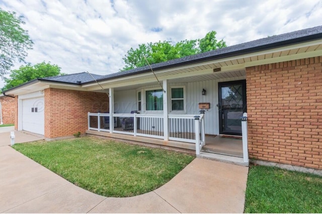 6102 Calumet Rd, Amarillo, TX 79106 - view of front of property with covered porch, an attached garage, and brick siding