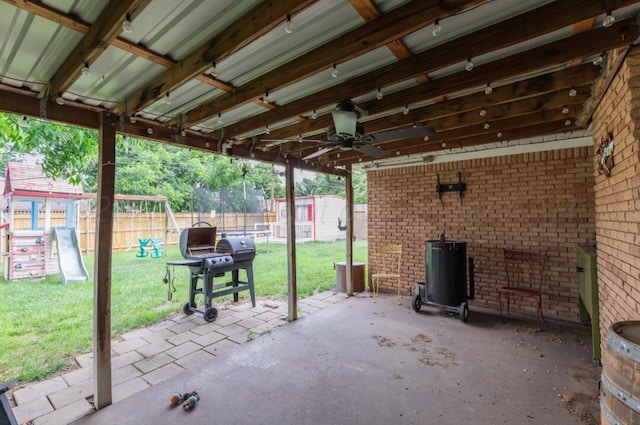 6102 Calumet Rd, Amarillo, TX 79106 - fenced backyard featuring a playground, a patio area, a shed, and ceiling fan