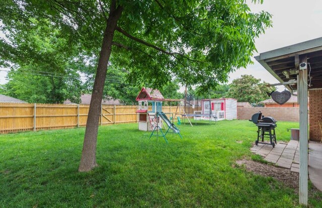 6102 Calumet Rd, Amarillo, TX 79106 - fenced backyard featuring a playground and a trampoline