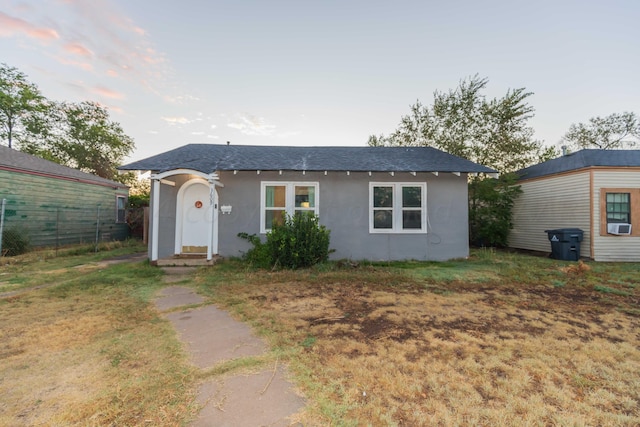 ranch-style home featuring cooling unit