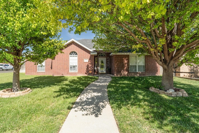 8301 San Antonio Dr, Amarillo, TX 79118 - view of front of property with brick siding and a front lawn