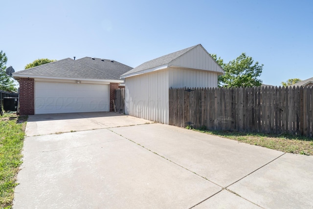 8301 San Antonio Dr, Amarillo, TX 79118 - view of front facade featuring fence, brick siding, a garage, and roof with shingles