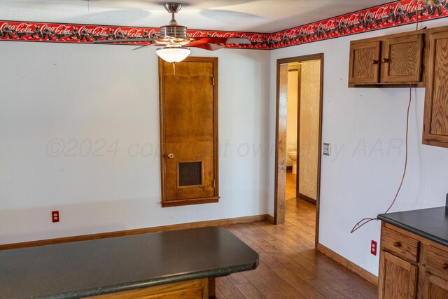 interior space featuring hardwood / wood-style floors and ceiling fan