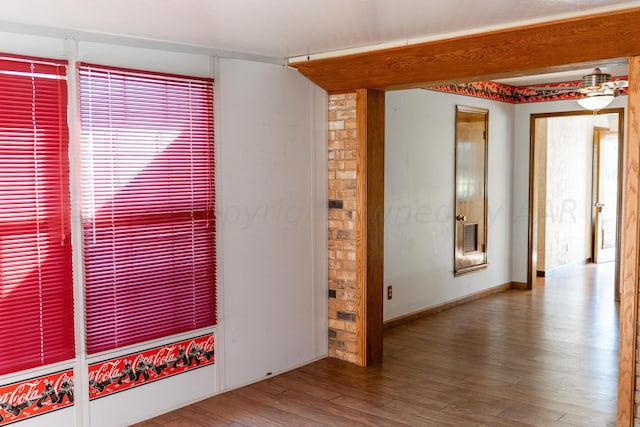 empty room with hardwood / wood-style floors