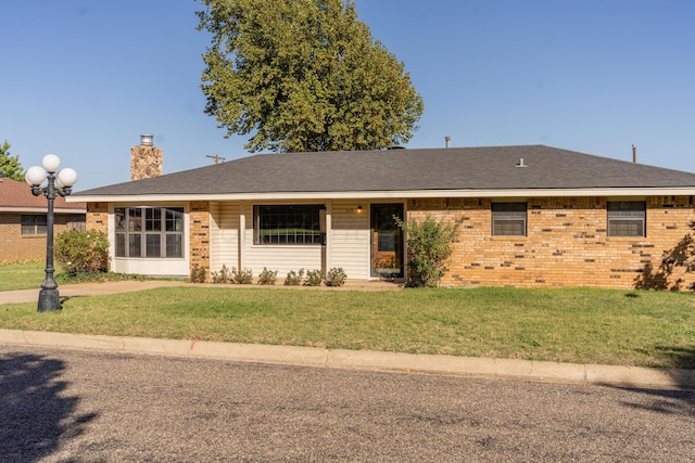 ranch-style home with a front yard