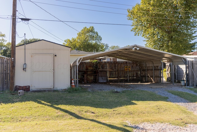 view of outbuilding featuring a lawn and a carport