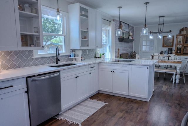 2211 N Aspen Dr, Pampa, TX 79065 - kitchen featuring dishwasher, a sink, light countertops, white cabinets, and ornamental molding