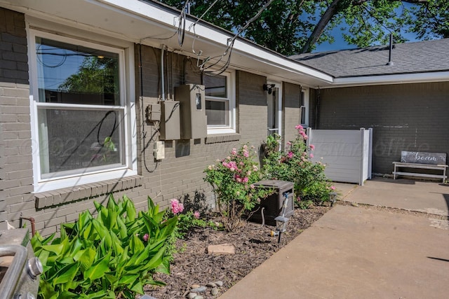2211 N Aspen Dr, Pampa, TX 79065 - property entrance featuring brick siding and a patio