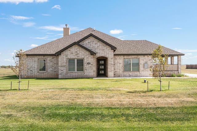 french country style house featuring a front lawn