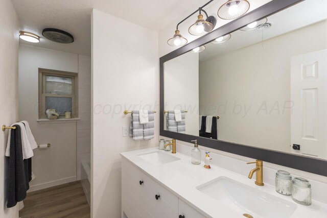 3301 Palmetto Trl, Amarillo, TX 79106 - bathroom with double vanity, wood finished floors, and baseboards