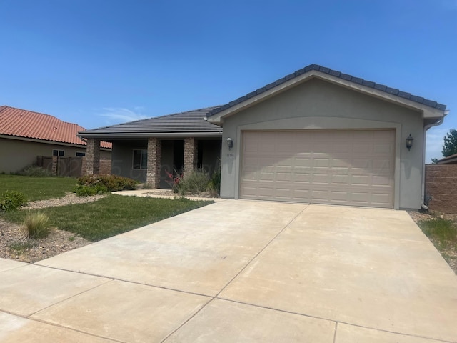 1104 Chardonnay Blvd, Amarillo, TX 79124 - single story home featuring concrete driveway, a front yard, a tile roof, and an attached garage