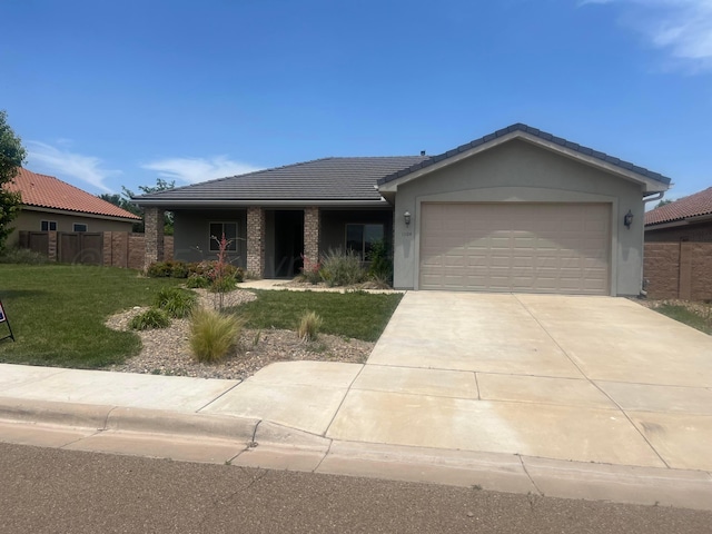 1104 Chardonnay Blvd, Amarillo, TX 79124 - ranch-style home featuring a garage, a tile roof, concrete driveway, and stucco siding