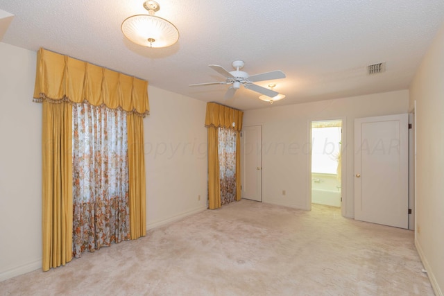 2807 S Harrison St, Amarillo, TX 79109 - spare room featuring a ceiling fan, light carpet, baseboards, and a textured ceiling
