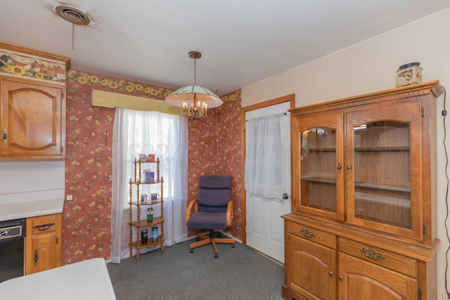 interior space with carpet and a chandelier