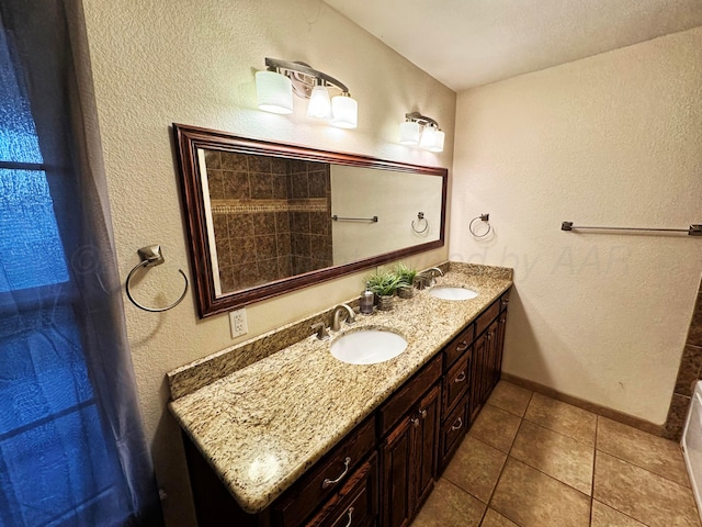 bathroom with tile patterned floors and vanity