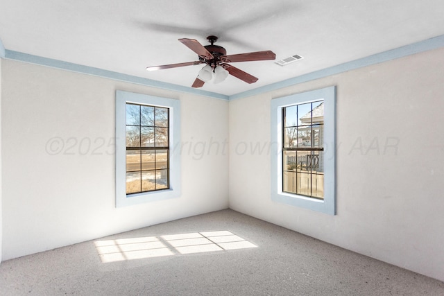 spare room with ceiling fan