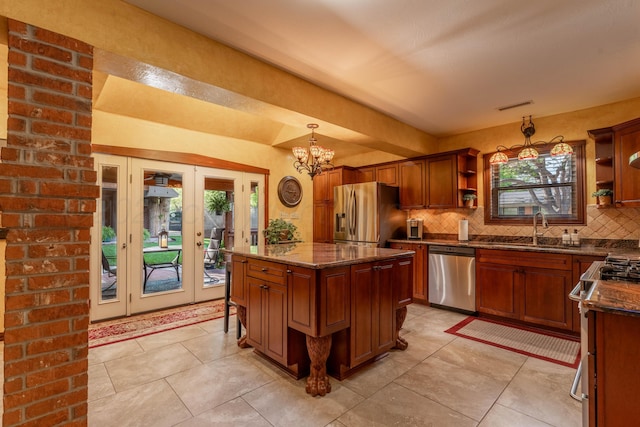 kitchen with open shelves, stainless steel appliances, a sink, and plenty of natural light