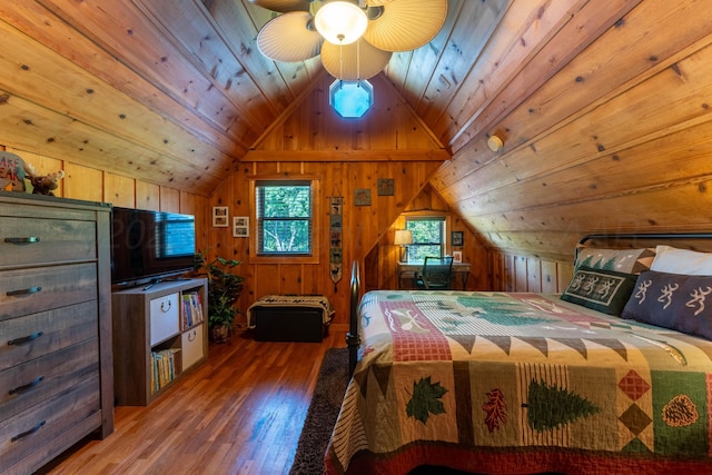 bedroom featuring lofted ceiling, wood finished floors, wooden walls, and wooden ceiling