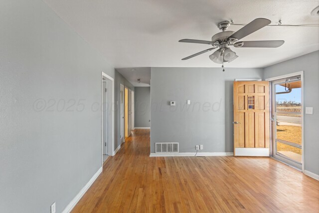 unfurnished room featuring hardwood / wood-style floors and ceiling fan