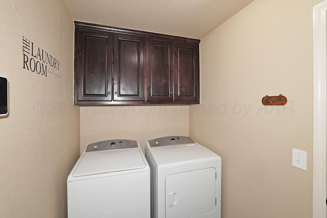 laundry area featuring cabinet space and washing machine and dryer