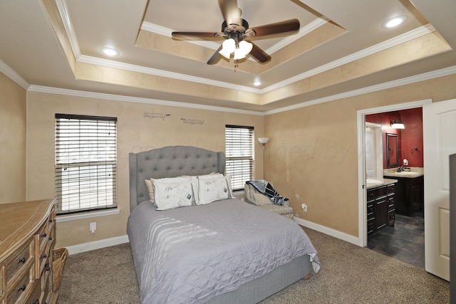 bedroom with ornamental molding, a raised ceiling, and baseboards