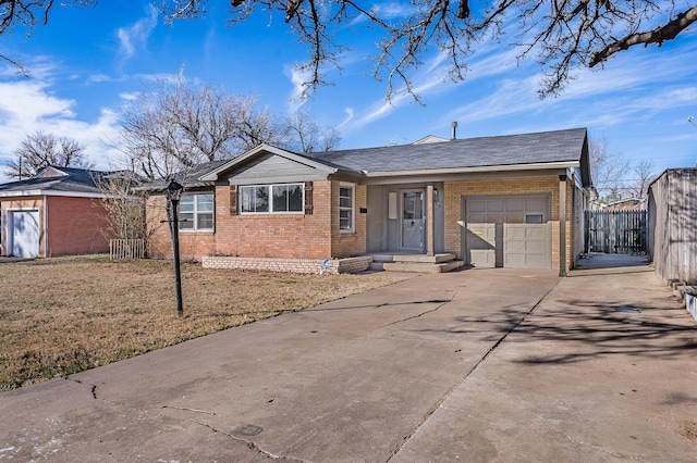 single story home with a garage and a front yard