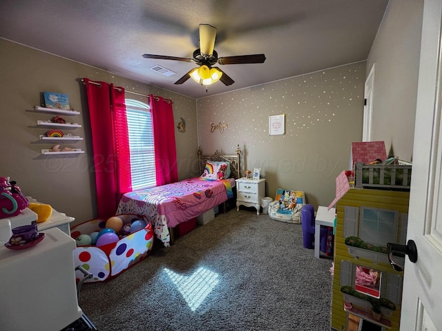 bedroom featuring carpet floors, wallpapered walls, visible vents, and a ceiling fan