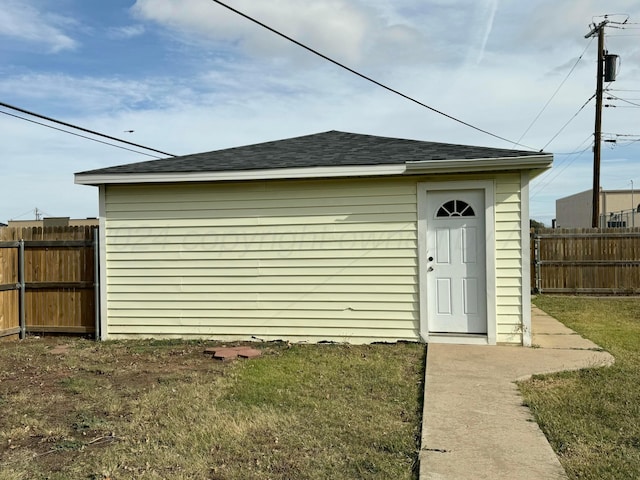 view of outdoor structure with a lawn