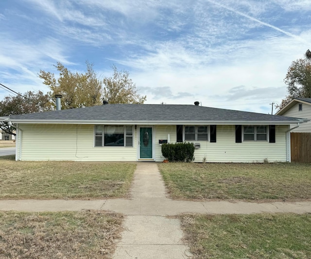 ranch-style home with a front yard