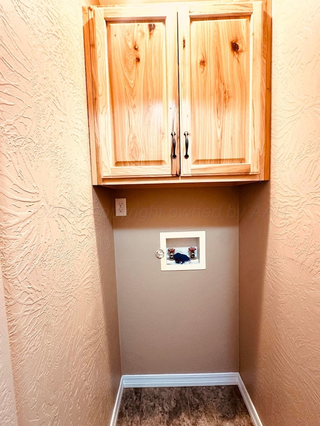 1521 Fox Ave, Dumas, TX 79029 - laundry area featuring cabinet space and washer hookup