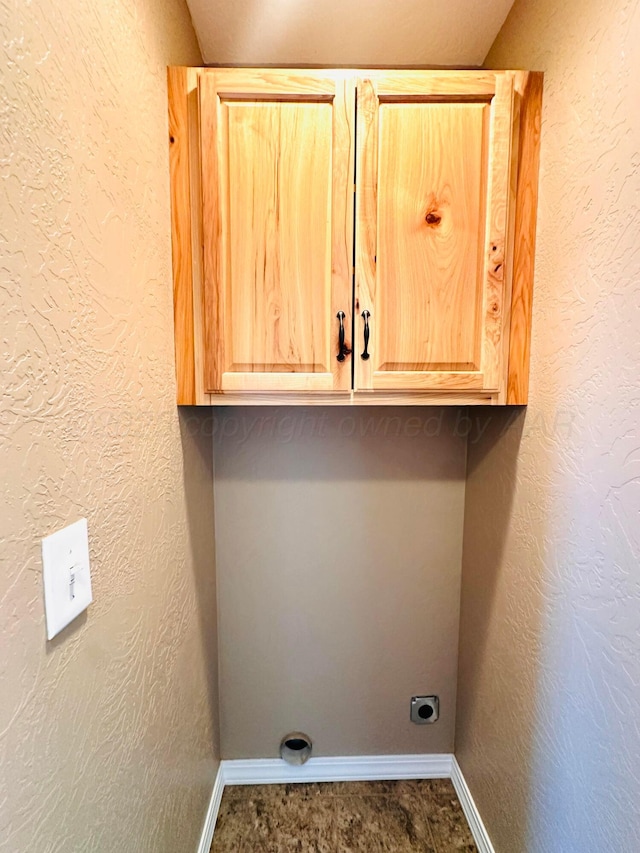 1521 Fox Ave, Dumas, TX 79029 - washroom with hookup for an electric dryer and cabinet space