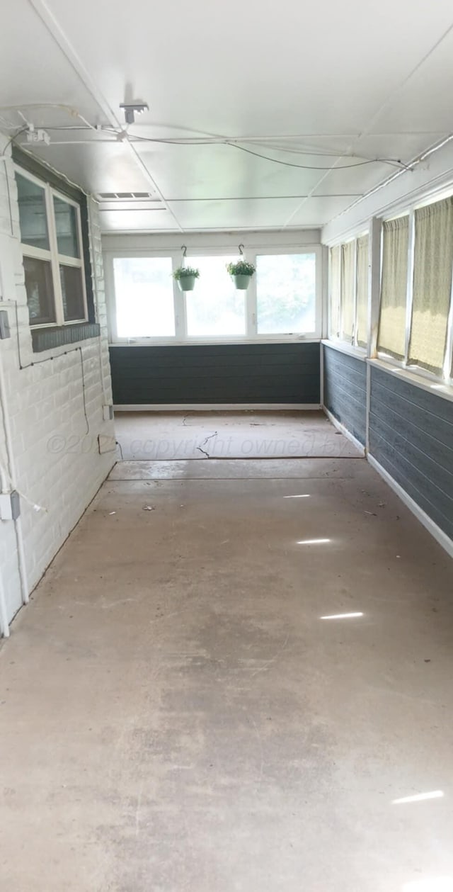 706 Mills Ave, Dumas, TX 79029 - unfurnished sunroom featuring plenty of natural light