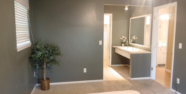 706 Mills Ave, Dumas, TX 79029 - bathroom with vanity and rail lighting