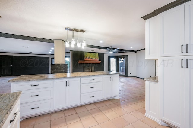 kitchen with white cabinetry and decorative light fixtures