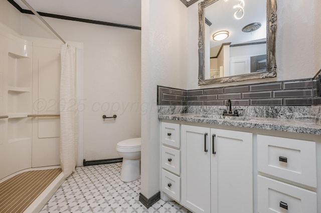 bathroom with vanity, a shower with curtain, ornamental molding, and toilet