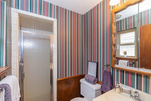 5025 S Fannin St, Amarillo, TX 79110 - bathroom with a shower stall, vanity, and wallpapered walls