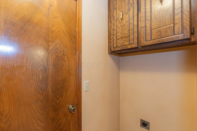 5025 S Fannin St, Amarillo, TX 79110 - laundry area with cabinet space and electric dryer hookup