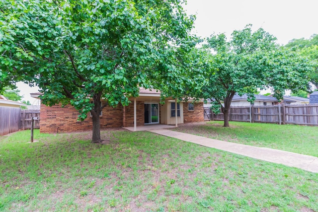 5025 S Fannin St, Amarillo, TX 79110 - rear view of property featuring a fenced backyard and brick siding