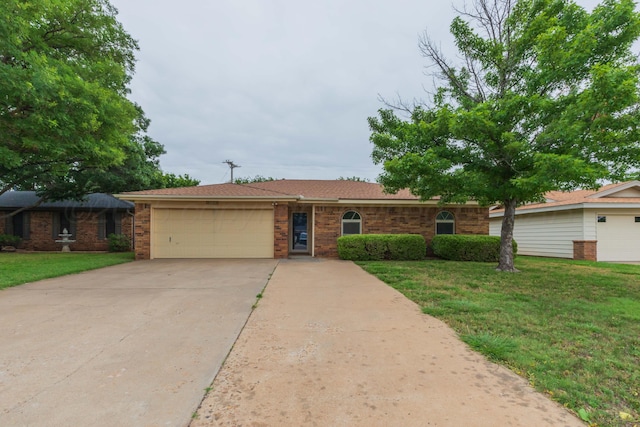 5025 S Fannin St, Amarillo, TX 79110 - single story home with a garage, driveway, a front lawn, and brick siding