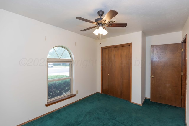 5025 S Fannin St, Amarillo, TX 79110 - unfurnished bedroom featuring carpet, a closet, and a ceiling fan