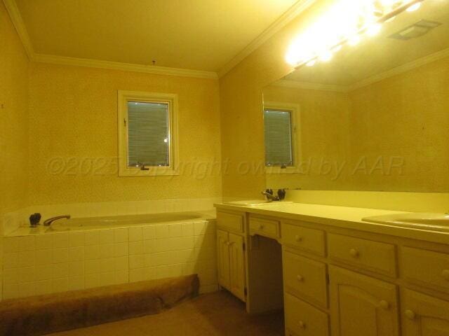 7503 Baughman Dr, Amarillo, TX 79121 - full bathroom featuring double vanity, a bath, and ornamental molding
