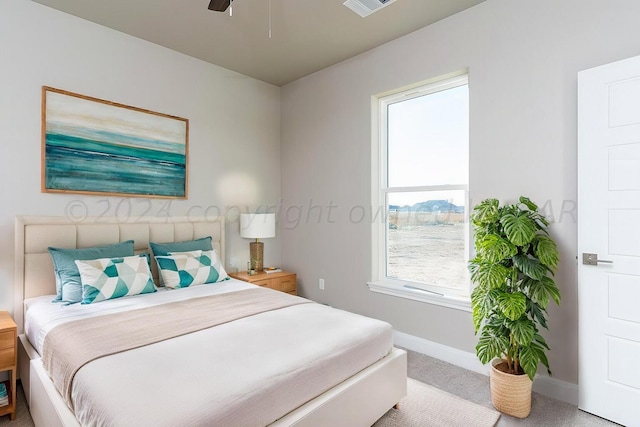 bedroom featuring a ceiling fan, carpet flooring, and baseboards