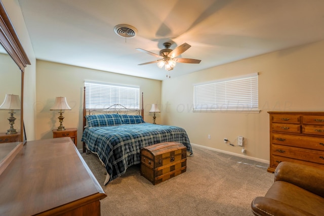 bedroom featuring ceiling fan and light colored carpet