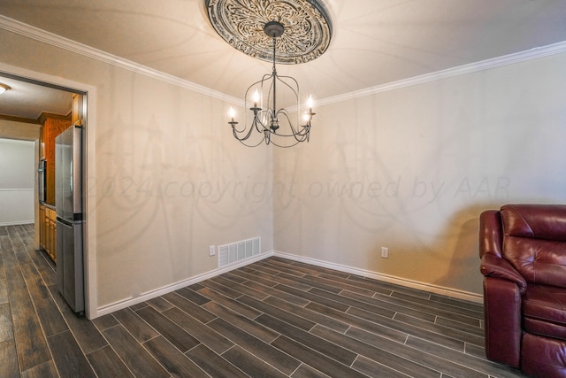 unfurnished dining area with a notable chandelier and ornamental molding