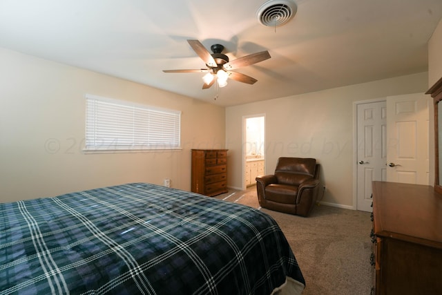 carpeted bedroom featuring ensuite bathroom and ceiling fan