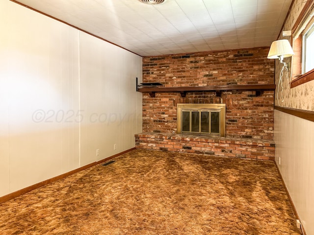 1705 Takewell St, Borger, TX 79007 - unfurnished living room featuring carpet flooring and a fireplace