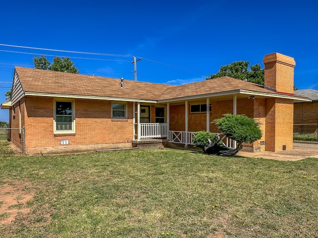 1705 Takewell St, Borger, TX 79007 - ranch-style house with brick siding, a chimney, covered porch, and a shingled roof