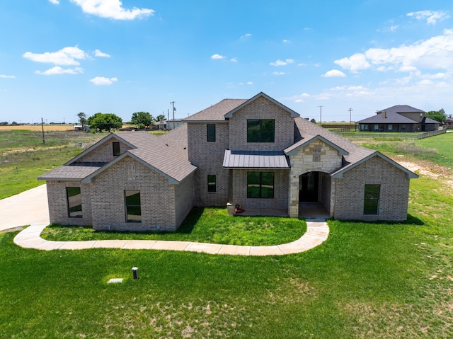 view of front of home with a front yard