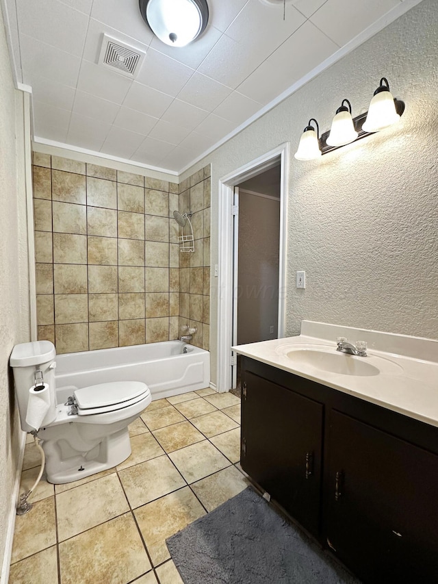 full bathroom featuring visible vents, vanity, a textured wall, shower / bathtub combination, and toilet